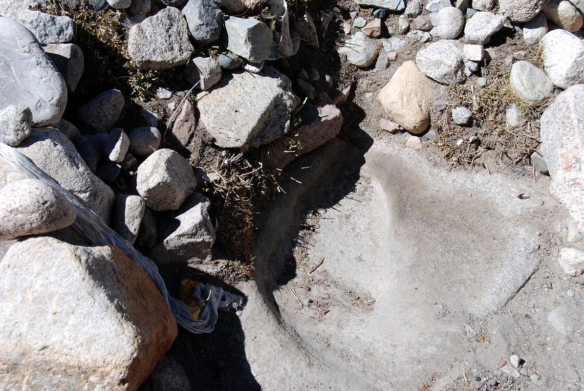 26 Milarepa Footprint At Tamdrin In The Lha Chu Valley On Mount Kailash Outer Kora A vivid footprint of Milarepa in a rock is next to Tamdrin in the Lha Chu Valley.